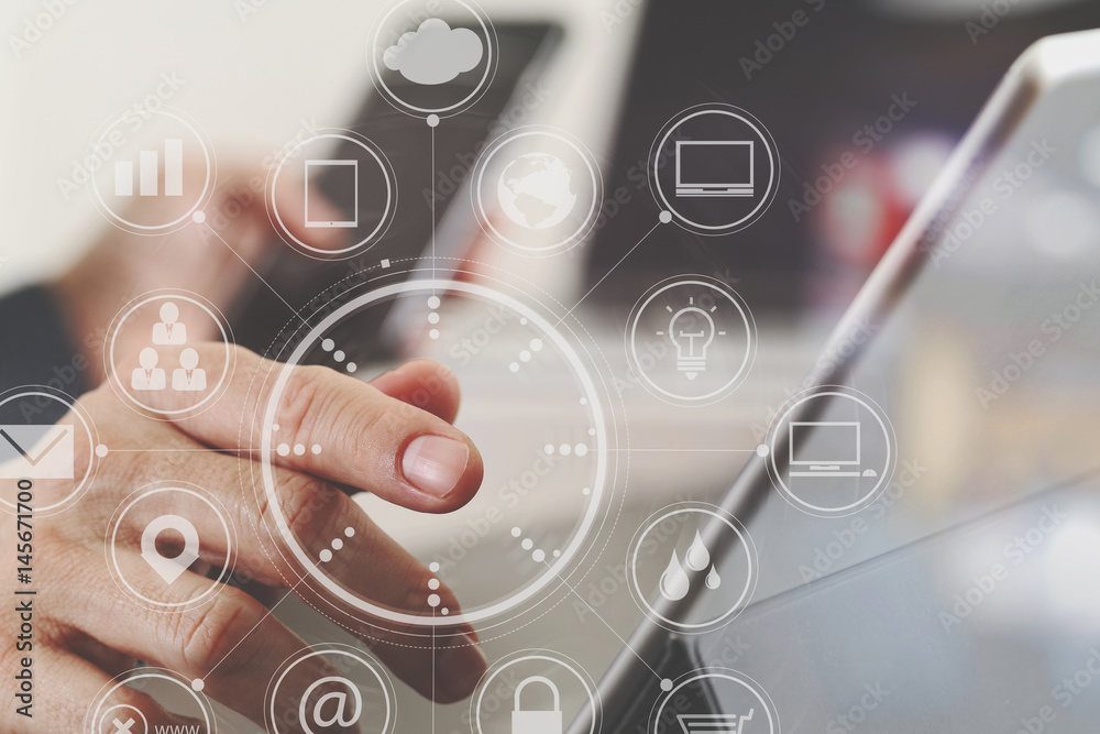 Aufkleber close up of businessman hand working with smart phone and laptop and digital tablet computer in modern office