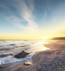 Sea shore during sunrise. Beautiful natural seascape