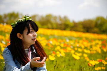 Naklejka na ściany i meble japanese young lady with flower crown in flower garden