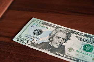 Money. American dollars isolated on white background and on a wooden background. Bundles of money
