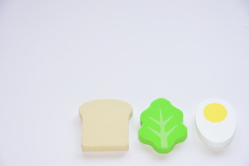 Well-balanced breakfast with wooden toys