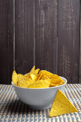 Potato chips in bowl on a table