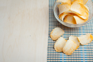 Potato chips in bowl on a table