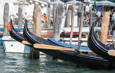 Fototapeta na wymiar Gondolas and paddels. Venice, Italy