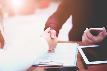 Business handshake and business people.Vintage tone