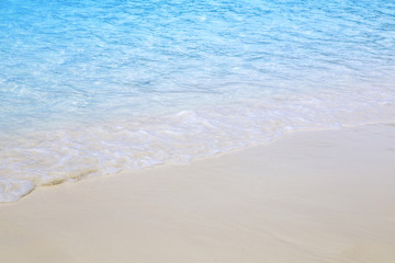 Fototapeta na wymiar Beautiful beach and tropical sea with Soft wave 