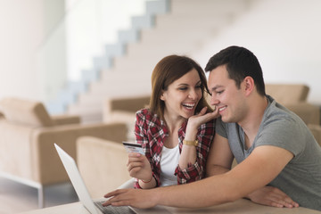 happy young couple buying online