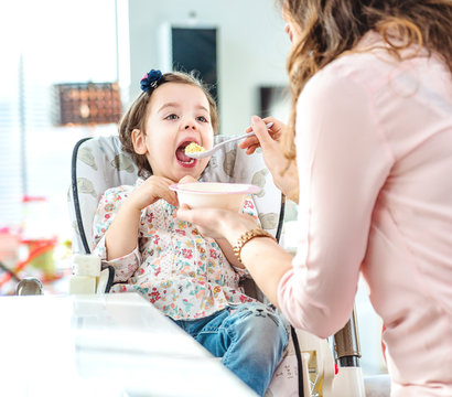 Mother Feeding Her Beloved Child