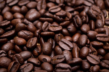 Organic coffee beans in background close up.