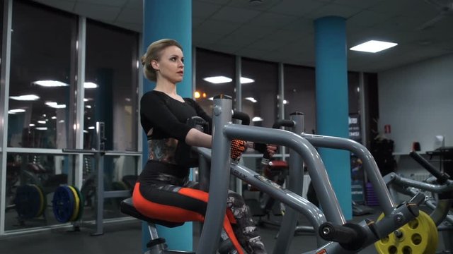 Girl in red leggings in the gym
