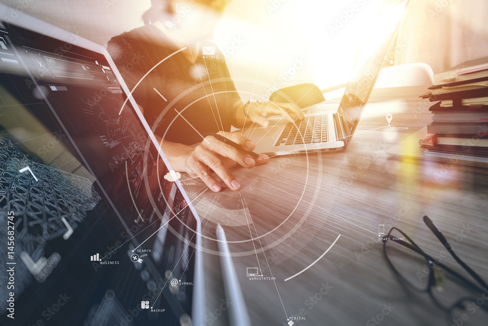 Poster businessman working with mobile phone and digital tablet and laptop computer on wooden desk in modern office with virtual icon diagram