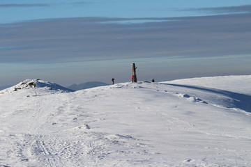 Fototapeta na wymiar Winter view of Wielka Rawka and its landmark