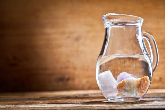 Jug of water with stones