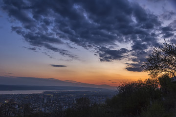Fototapeta na wymiar Beautiful sunset with dramatic clouds over the city . Varna, Bulgaria