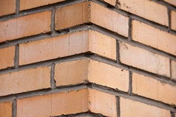 Orange brick wall background close up