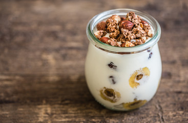 Serving of Yogurt with  Muesli, Banana and Nuts with Copyspace