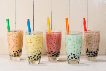 Boba / Bubble tea. Homemade Various Milk Tea with Pearls on wooden table.