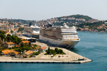 wo large liners stand in the Bay of Gruz in the international sea port in Dubrovnik, Croatia.