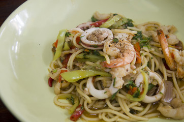 Spaghetti fried spicy mixed seafood with chilli and Basil leaves thai style