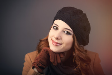 portrait of beautiful young woman on the wonderful grey studio background