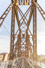 Hanoi, Vietnam - April, 2017: Long Bien Bridge (Vietnamese: Cau Long Bien) is an historic cantilever bridge across the Red River that connects two districts of Hanoi, Vietnam.