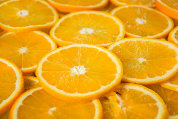 Fototapeta na wymiar Pile of sliced oranges