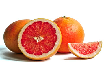 Closeup of red grapefruits on a white background