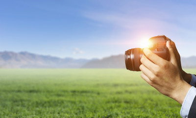 Man with camera in hands