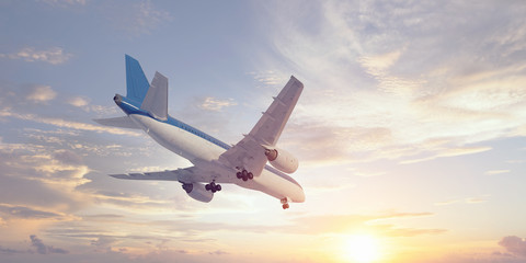 Fototapeta na wymiar Airplane in day sky. Mixed media