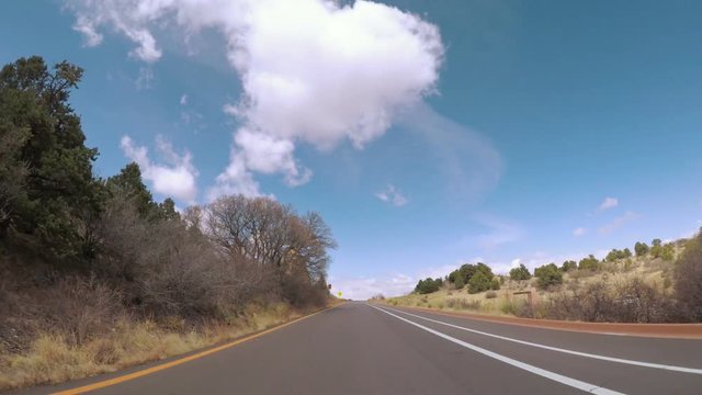 POV point of view - Driving through the park with large red sanstone formations