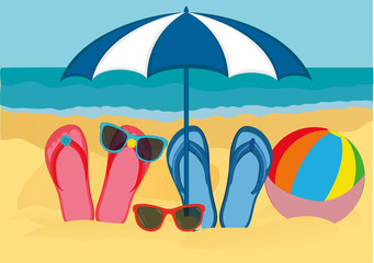 Flip-flops and sunglasses with a beach umbrella on the sandy beach