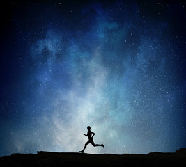 Jogger running at night . Mixed media