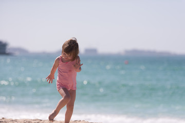 Fototapeta premium little cute girl at beach