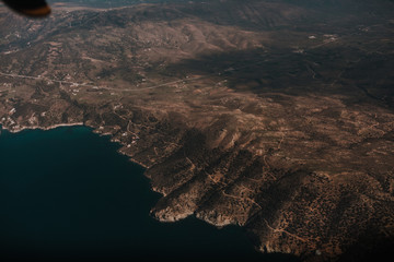 Fototapeta na wymiar View from an airplane flying over the Cyclades archipelago,Aegean sea