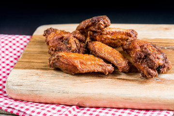 delicious fried chicken wings with sauce