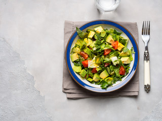Healthy avocado spinach tomato salad. Gourmet dieting