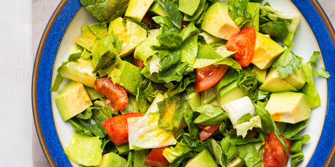 Healthy avocado spinach tomato salad. Gourmet dieting