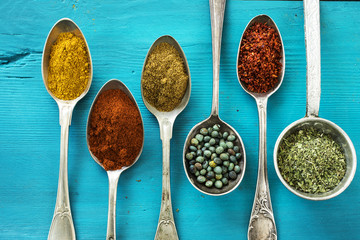 Spices and herbs on wooden background