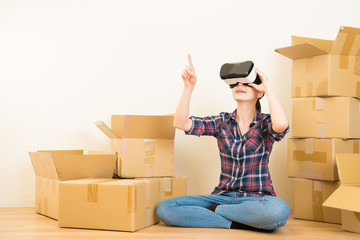 woman moving house working with VR headset