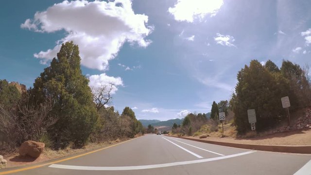 POV point of view - Driving through the park with large red sanstone formations