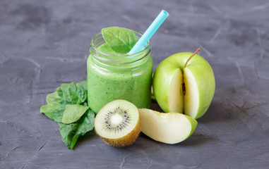 Green smoothie with ingredients: apples, spinach, cucumber and kiwi
