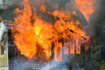 Close up of burning house.