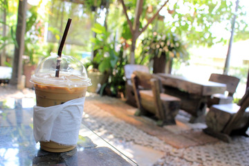 Iced coffee in a sunny tropical garden in Asia