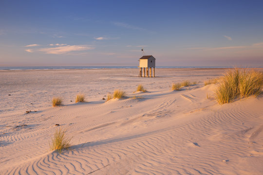 Refuge hut on Terschelling island in The Netherlands at sunset