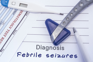 Diagnosis Febrile Seizures. Paper medical report written with neurological diagnosis of Febrile Seizures is surrounded by a neurological reflex hammer, electronic thermometer and common blood test