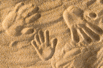 Hand prints on a sand