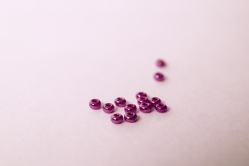 Heaps of violet glass beads