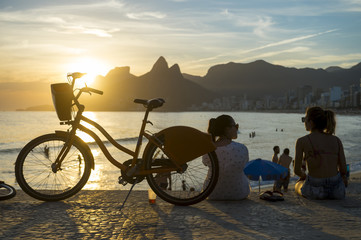 Silhouettes gathered to watch the sunset in Rio de Janeiro, Brazil