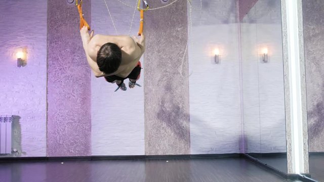 A man performs exercises alfagraviti in the studio 4k