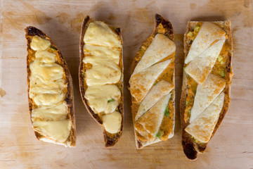 Overhead of Slices of Toasted Bread Topped with Mozzarella Cheese